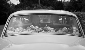 bride and groom in a car